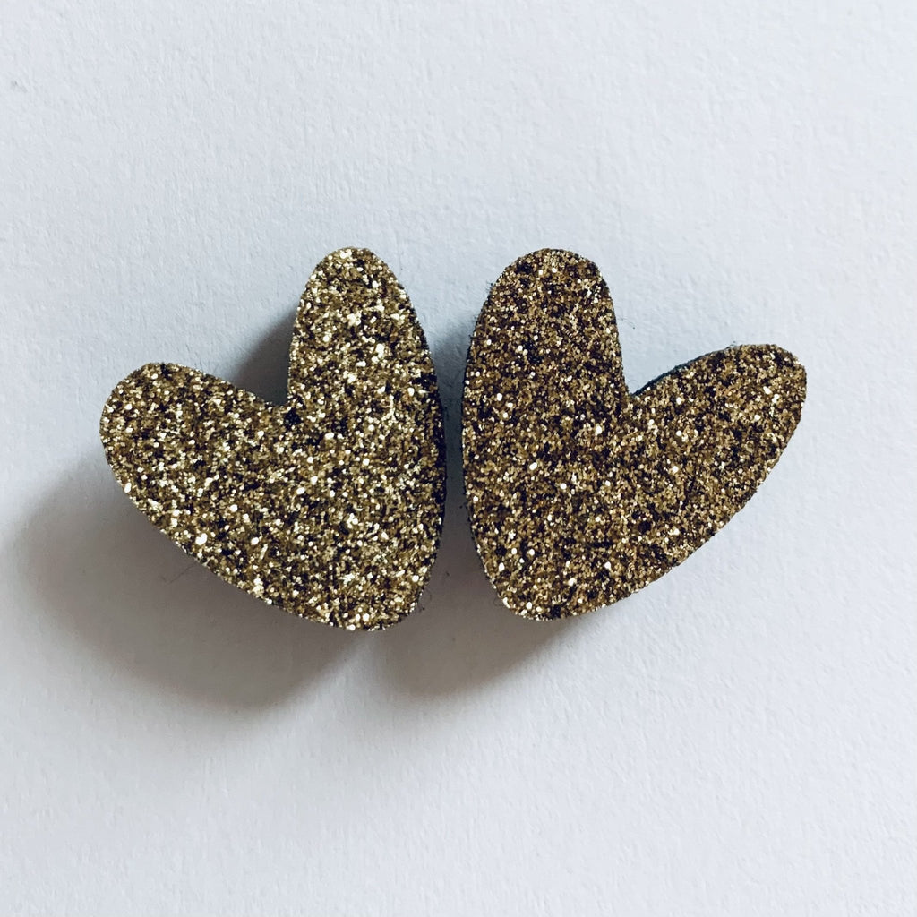 Pin's enfant cœurs à partager doré – les petites hirondelles
